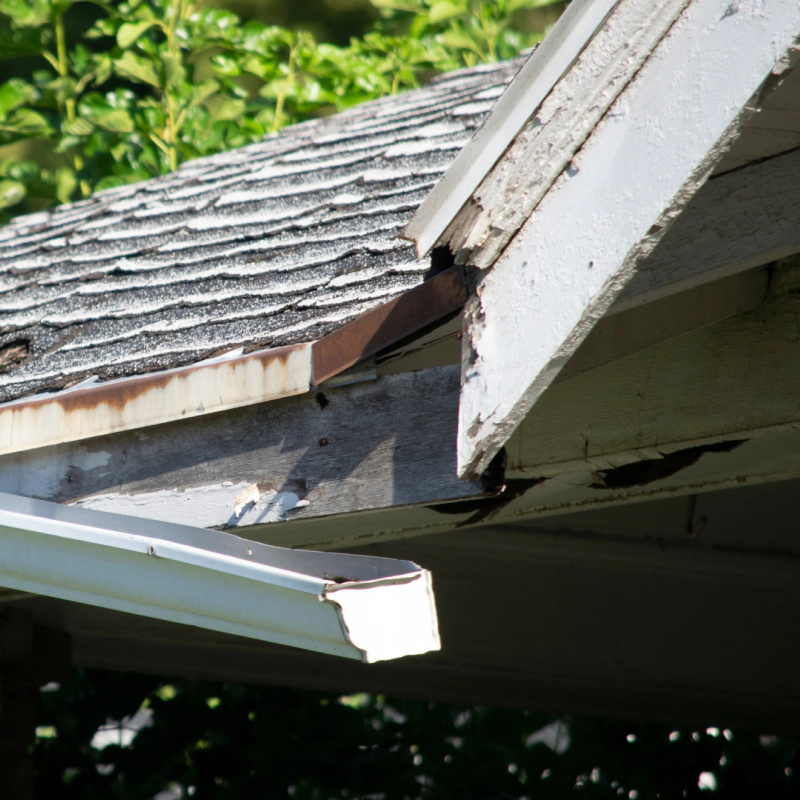 a broken gutter that needs repairs
